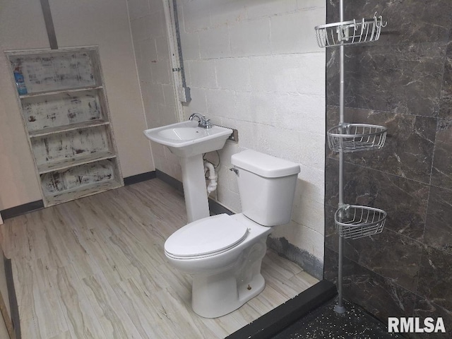 1519 S 3rd St, Pekin, IL 61554 - bathroom with concrete block wall and wood finished floors