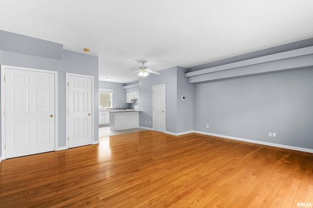 2024 S 2nd Ave, Morton, IL 61550 - unfurnished living room featuring light wood finished floors and ceiling fan
