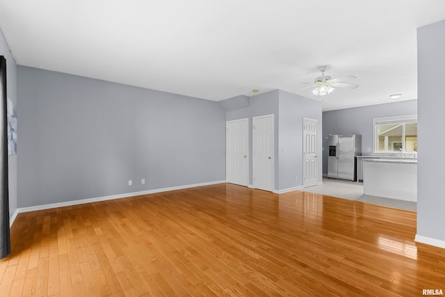 2024 S 2nd Ave, Morton, IL 61550 - unfurnished living room featuring ceiling fan and light wood finished floors