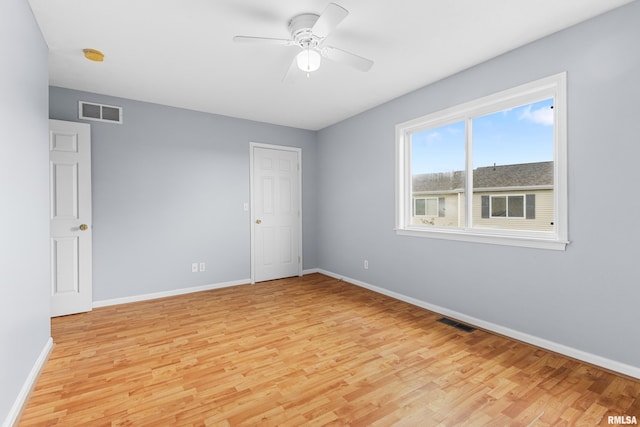 2024 S 2nd Ave, Morton, IL 61550 - unfurnished room with light wood-style floors, ceiling fan, and a smoke detector