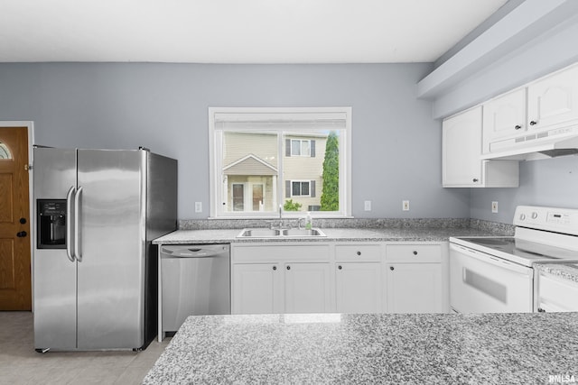 2024 S 2nd Ave, Morton, IL 61550 - kitchen featuring appliances with stainless steel finishes, under cabinet range hood, white cabinetry, and light tile patterned floors