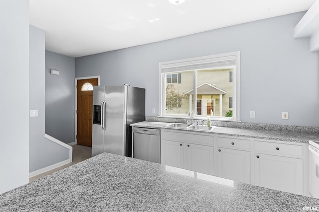 2024 S 2nd Ave, Morton, IL 61550 - kitchen featuring appliances with stainless steel finishes, white cabinetry, and light stone countertops