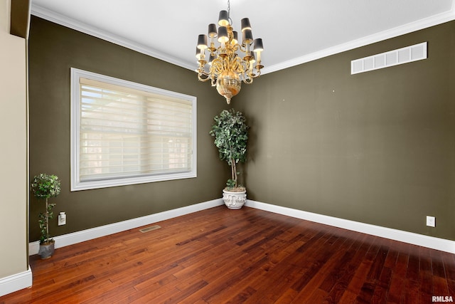 2627 W Lake Pointe Ter, Peoria, IL 61614 - empty room featuring a chandelier, hardwood / wood-style flooring, and ornamental molding