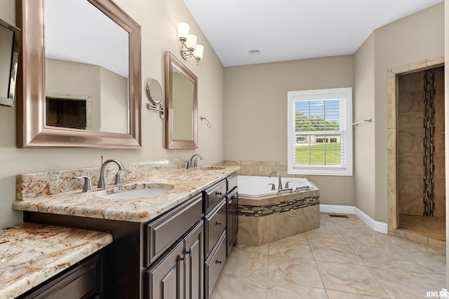 2627 W Lake Pointe Ter, Peoria, IL 61614 - full bath featuring a garden tub, double vanity, a tile shower, and marble finish flooring