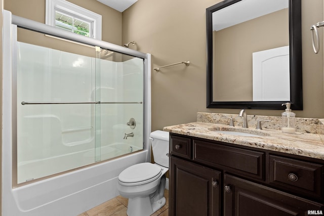 2627 W Lake Pointe Ter, Peoria, IL 61614 - bathroom featuring vanity, combined bath / shower with glass door, and tile patterned floors