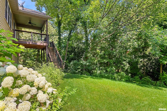 2627 W Lake Pointe Ter, Peoria, IL 61614 - view of green lawn with ceiling fan and stairway