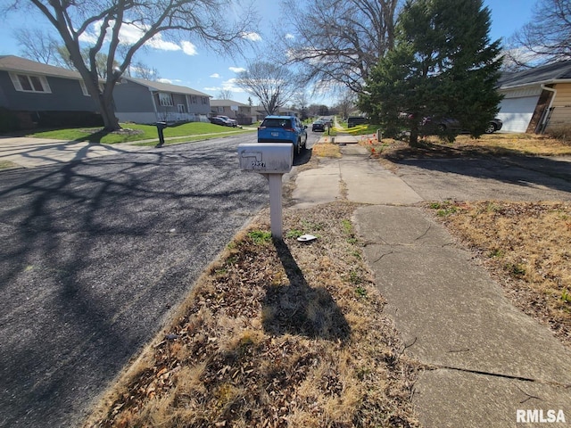 2827 W Larchmont Ln, Peoria, IL 61615 - view of asphalt street with a residential view and sidewalks