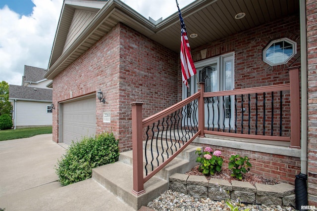 2203 W Gerald Ct, Peoria, IL 61615 - view of side of property with brick siding, concrete driveway, and a garage