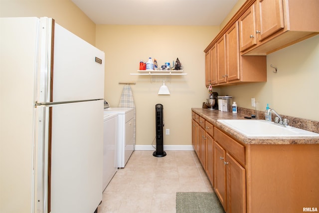 2203 W Gerald Ct, Peoria, IL 61615 - laundry area with separate washer and dryer, light tile patterned floors, and cabinet space