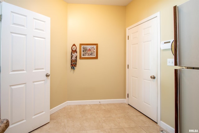 2203 W Gerald Ct, Peoria, IL 61615 - hall featuring baseboards and light tile patterned floors
