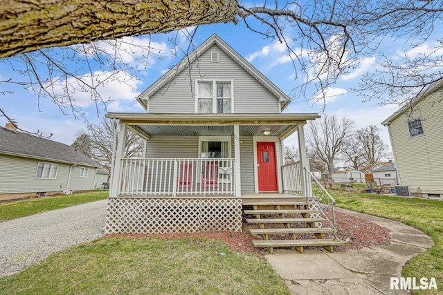 903 E Lake Ave, Peoria Heights, IL 61616 - bungalow-style house with a porch and a front yard