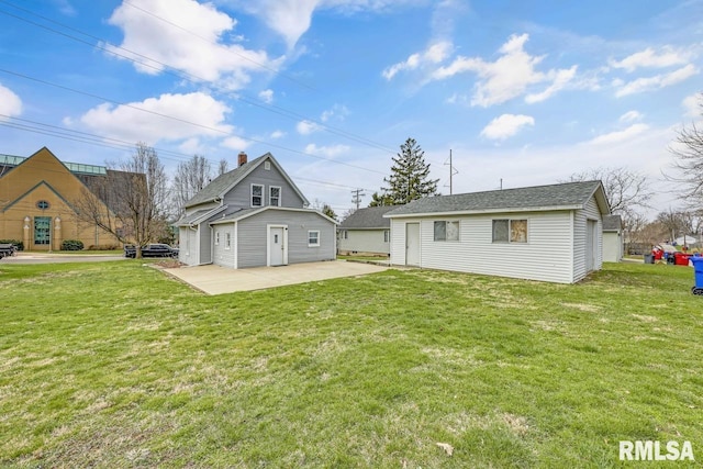 903 E Lake Ave, Peoria Heights, IL 61616 - rear view of property featuring a yard, an outdoor structure, and a patio area