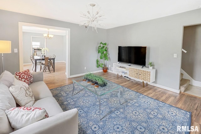 903 E Lake Ave, Peoria Heights, IL 61616 - living room with a chandelier, wood finished floors, and stairs