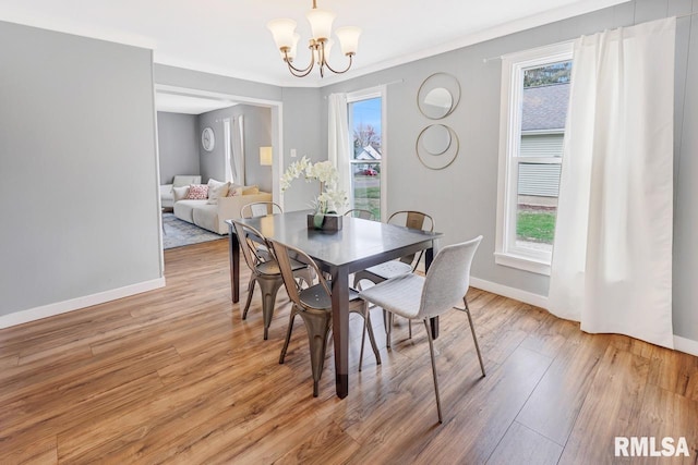 903 E Lake Ave, Peoria Heights, IL 61616 - dining room featuring a chandelier and light wood-type flooring