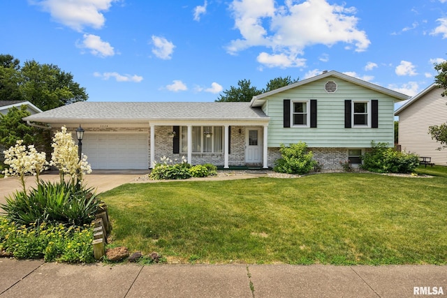 3524 W Saymore Ln, Peoria, IL 61615 - tri-level home featuring an attached garage, driveway, a front lawn, and brick siding