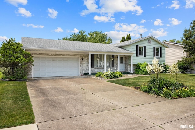 3524 W Saymore Ln, Peoria, IL 61615 - tri-level home with a porch, a garage, a front yard, concrete driveway, and roof with shingles