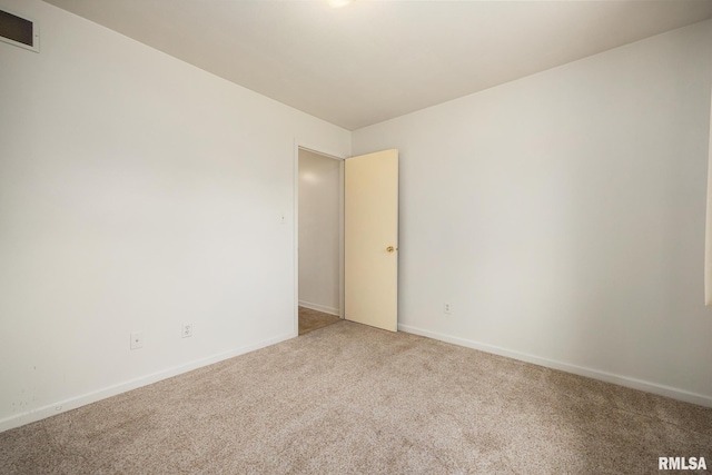 3524 W Saymore Ln, Peoria, IL 61615 - empty room with light colored carpet and baseboards