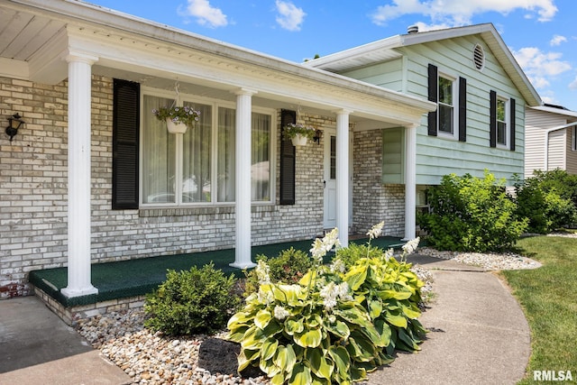 3524 W Saymore Ln, Peoria, IL 61615 - entrance to property featuring a porch and brick siding