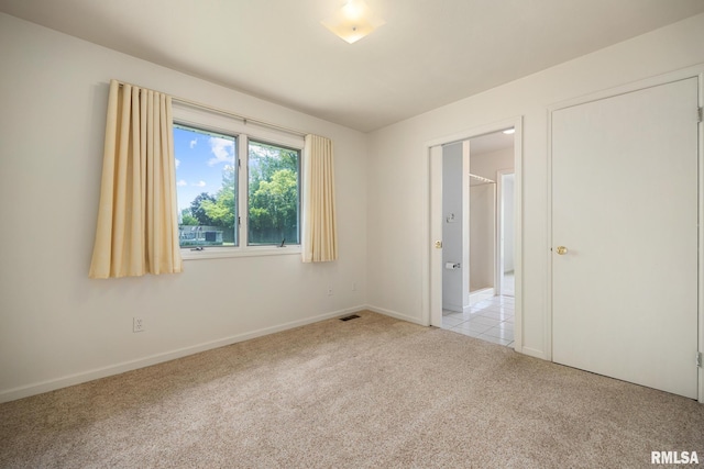 3524 W Saymore Ln, Peoria, IL 61615 - unfurnished bedroom featuring light colored carpet and baseboards