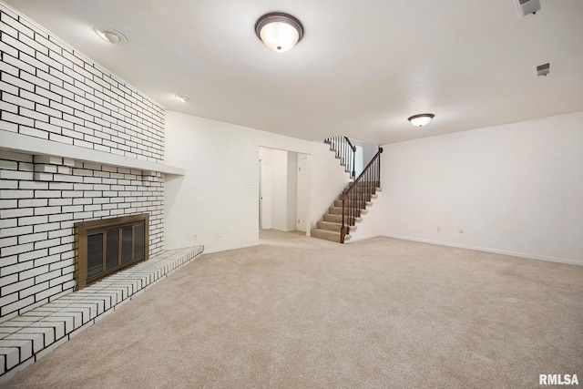 3524 W Saymore Ln, Peoria, IL 61615 - unfurnished living room with stairway, carpet flooring, and a brick fireplace