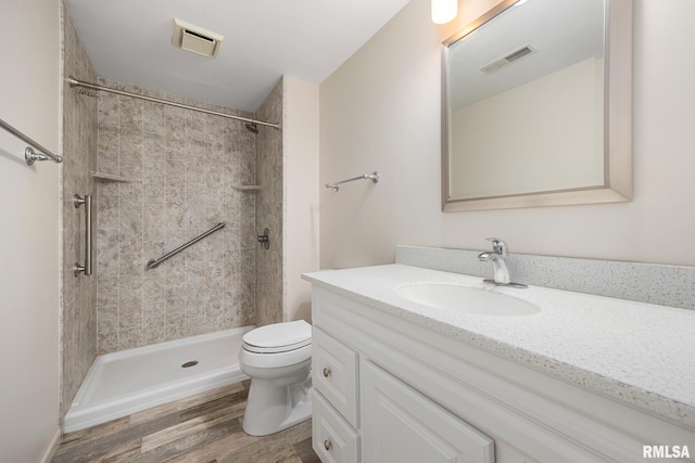 3524 W Saymore Ln, Peoria, IL 61615 - full bathroom featuring vanity, wood finished floors, and tiled shower