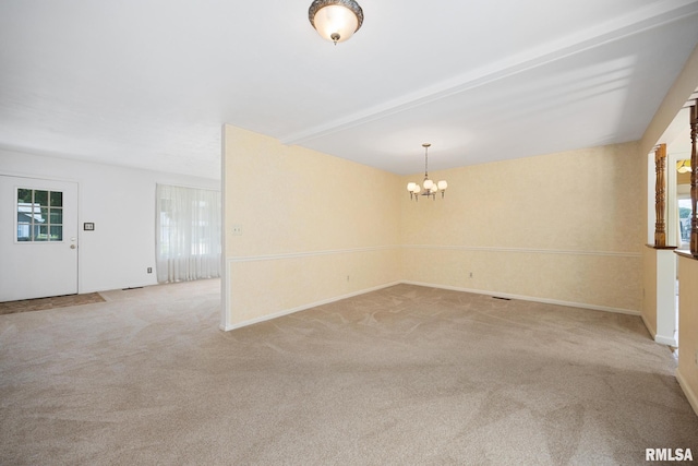3524 W Saymore Ln, Peoria, IL 61615 - spare room featuring a chandelier, light carpet, and healthy amount of natural light