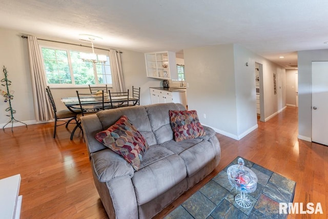 926 Birchwood Dr, Washington, IL 61571 - living room with light wood-type flooring and a chandelier
