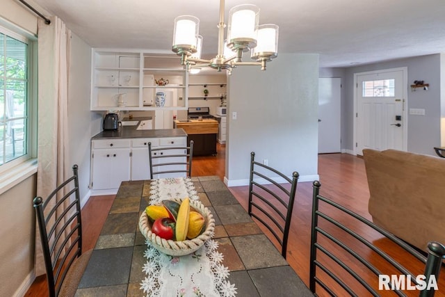 926 Birchwood Dr, Washington, IL 61571 - dining space with a chandelier and dark wood-type flooring