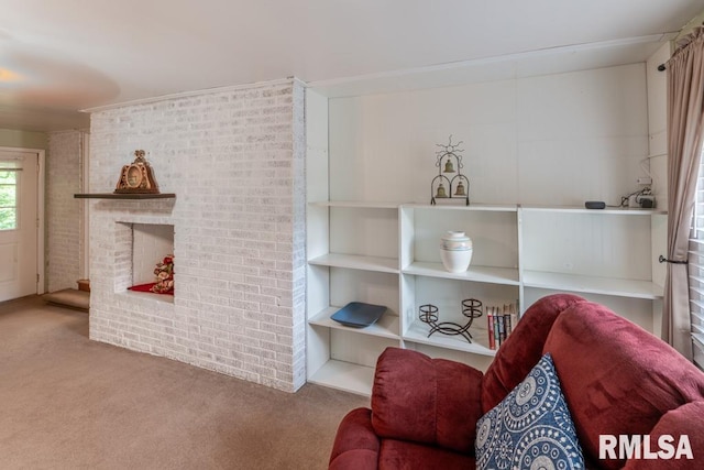 926 Birchwood Dr, Washington, IL 61571 - sitting room featuring carpet flooring, brick wall, and a fireplace