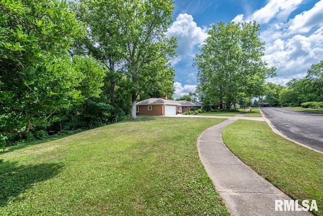 926 Birchwood Dr, Washington, IL 61571 - view of grassy yard with a garage and driveway