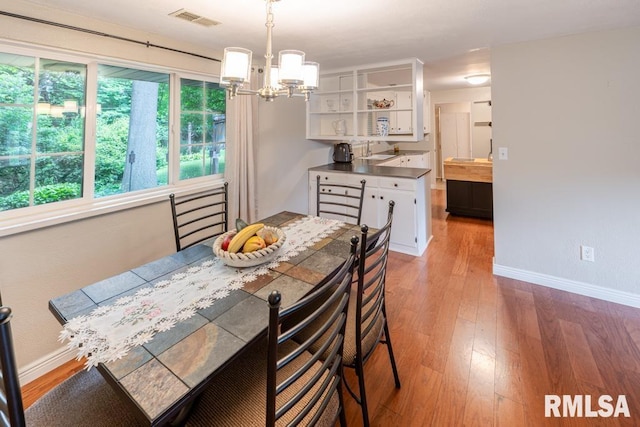926 Birchwood Dr, Washington, IL 61571 - dining room with a chandelier and light wood-type flooring