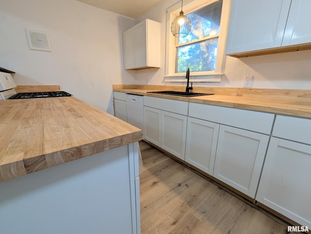 218 Meadow Lawn St, Manito, IL 61546 - kitchen with wooden counters, dishwasher, range with gas stovetop, light wood-style flooring, and hanging light fixtures