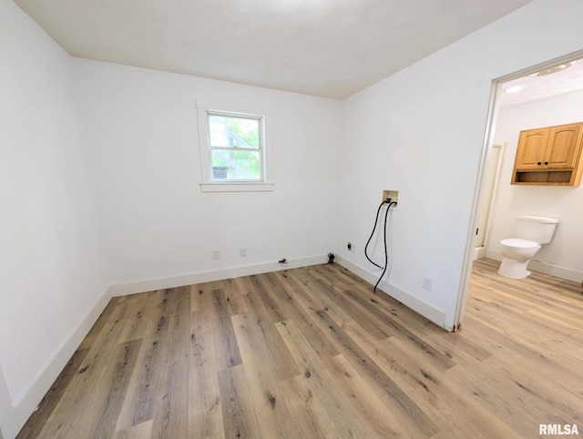 218 Meadow Lawn St, Manito, IL 61546 - washroom with washer hookup, light wood-style flooring, and cabinet space