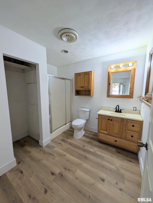 218 Meadow Lawn St, Manito, IL 61546 - bathroom featuring vanity, a stall shower, and wood finished floors