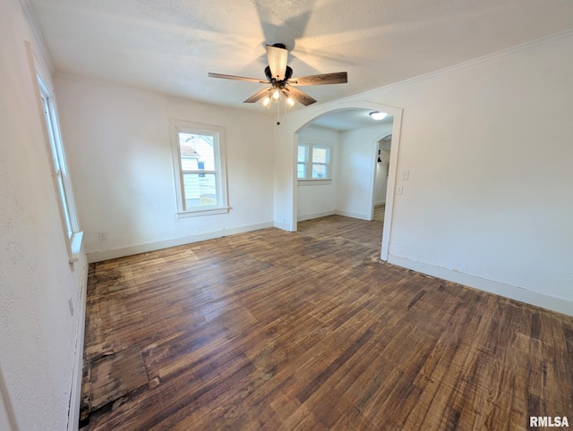 218 Meadow Lawn St, Manito, IL 61546 - spare room featuring wood finished floors, a ceiling fan, arched walkways, and crown molding