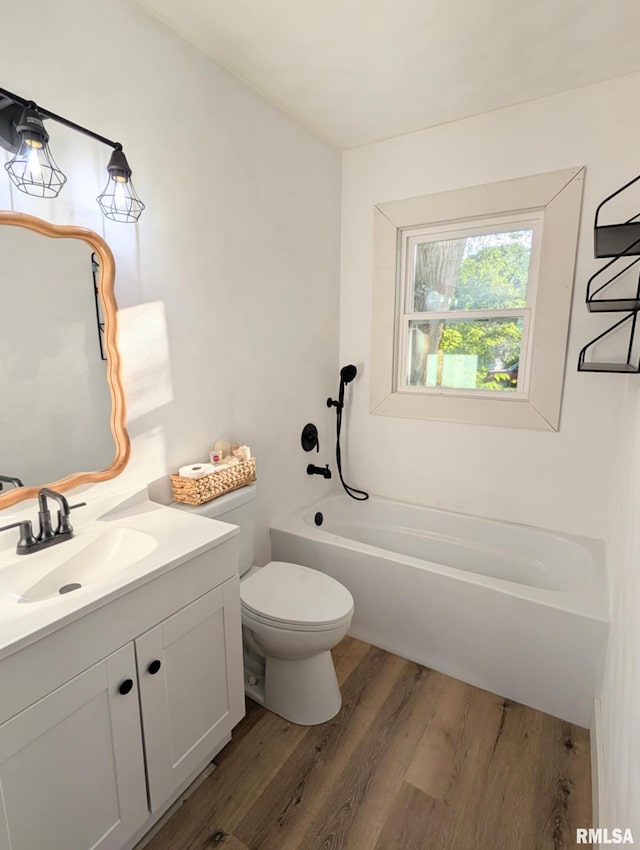218 Meadow Lawn St, Manito, IL 61546 - bathroom with wood finished floors, a bath, and vanity