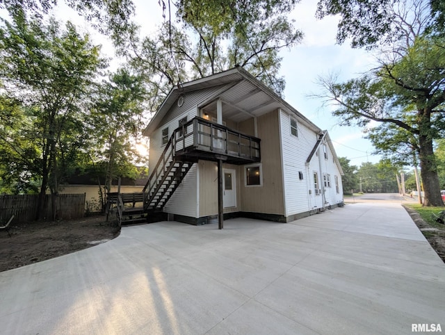 218 Meadow Lawn St, Manito, IL 61546 - rear view of property featuring stairway and a balcony