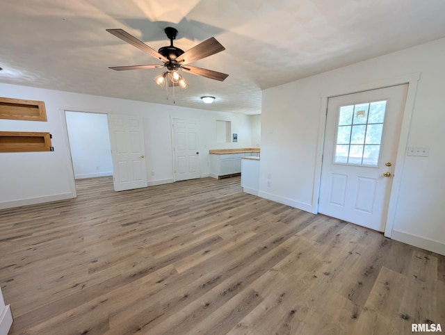 218 Meadow Lawn St, Manito, IL 61546 - unfurnished living room featuring light wood-type flooring and ceiling fan