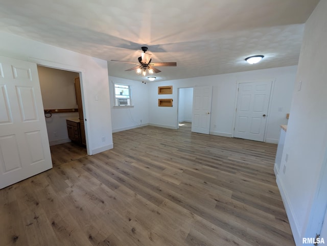 218 Meadow Lawn St, Manito, IL 61546 - unfurnished bedroom with wood finished floors and ceiling fan