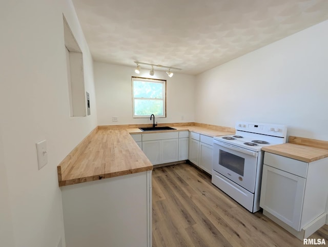 218 Meadow Lawn St, Manito, IL 61546 - kitchen featuring white electric range oven, wood counters, light wood finished floors, rail lighting, and white cabinetry