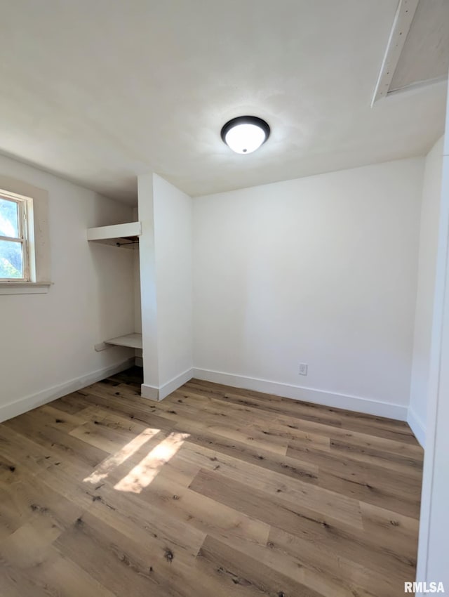218 Meadow Lawn St, Manito, IL 61546 - unfurnished bedroom with wood finished floors and a closet