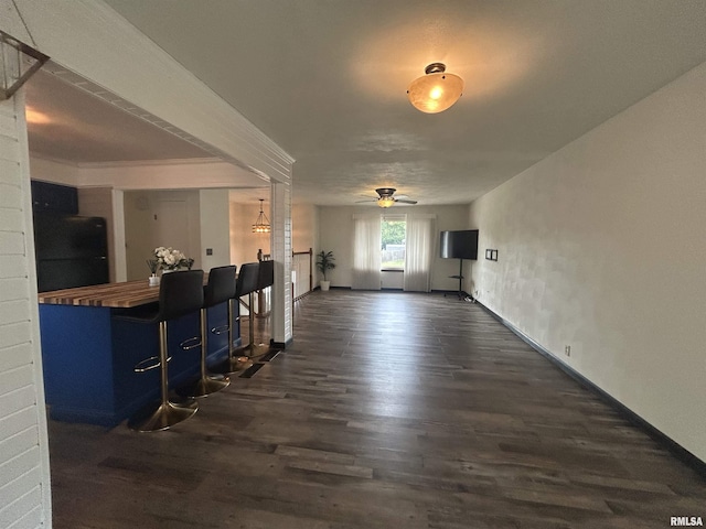 3406 W Brookside Dr, Peoria, IL 61615 - living area with dark wood-style floors and ceiling fan