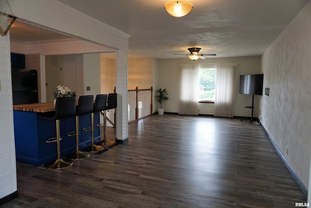 3406 W Brookside Dr, Peoria, IL 61615 - interior space with ceiling fan and dark wood-type flooring