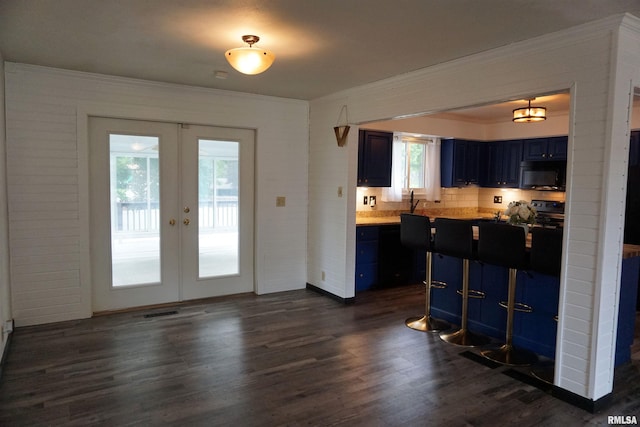 3406 W Brookside Dr, Peoria, IL 61615 - kitchen with black microwave, crown molding, french doors, dark wood-style flooring, and blue cabinets