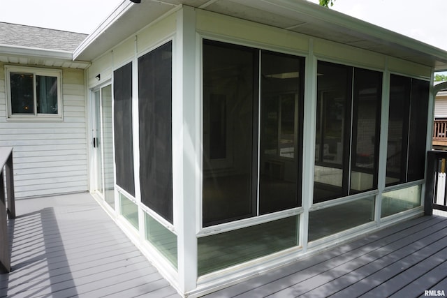 3406 W Brookside Dr, Peoria, IL 61615 - wooden deck featuring a sunroom