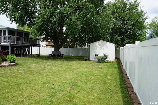 3406 W Brookside Dr, Peoria, IL 61615 - fenced backyard with a storage unit, a wooden deck, and a sunroom