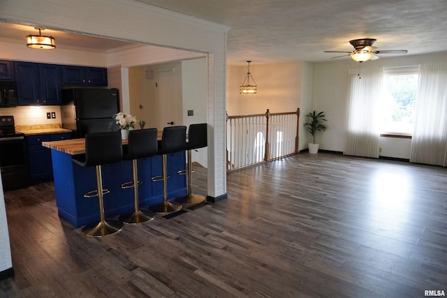 3406 W Brookside Dr, Peoria, IL 61615 - kitchen with black appliances, blue cabinetry, a ceiling fan, dark wood-style floors, and crown molding