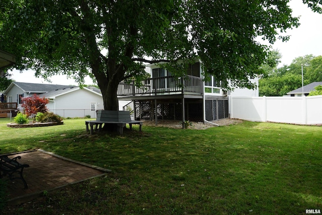 3406 W Brookside Dr, Peoria, IL 61615 - fenced backyard featuring a deck, stairway, and a patio area
