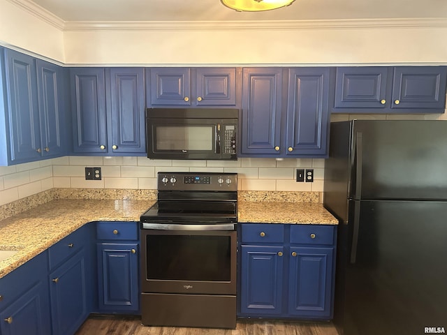 3406 W Brookside Dr, Peoria, IL 61615 - kitchen with freestanding refrigerator, black microwave, electric range, blue cabinets, and decorative backsplash