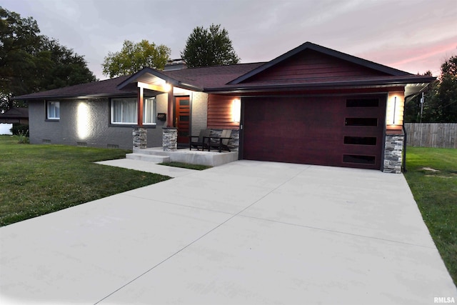 4527 N Nelson Dr, Peoria, IL 61614 - view of front of house with a garage, driveway, and crawl space